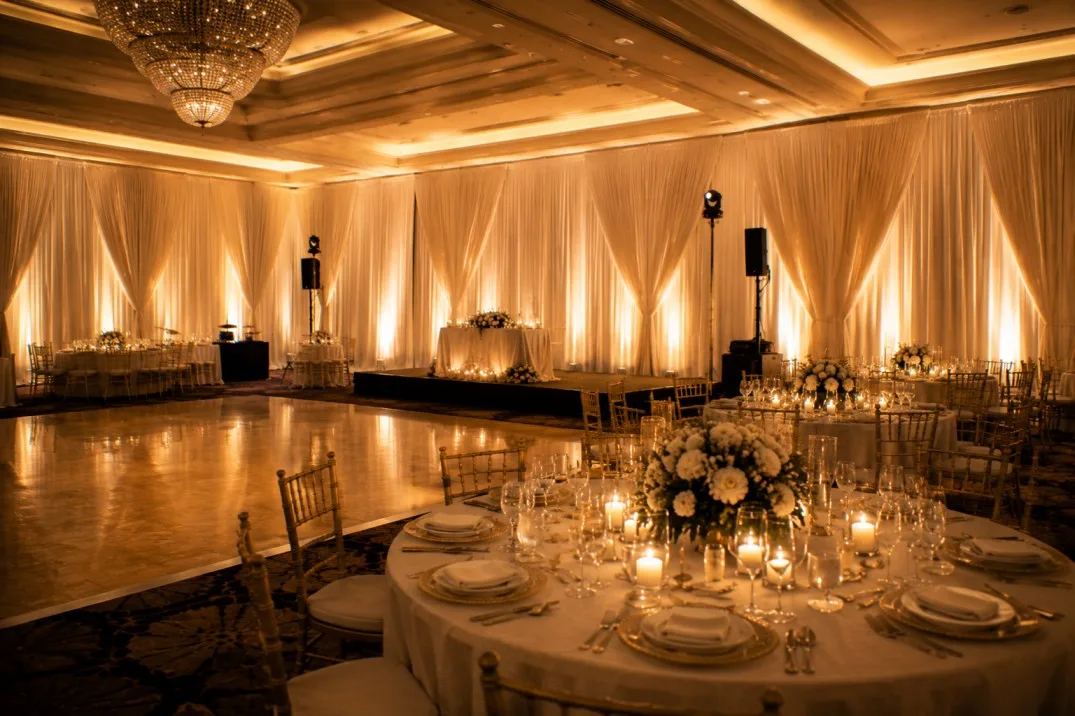 Elegant ballroom transformed with floor to ceiling event draping