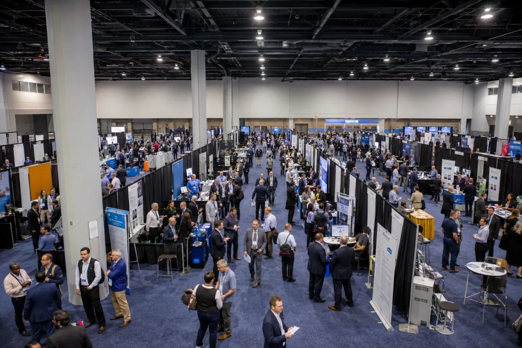 Illustrative professional trade show floor with pipe and drape booth divisions